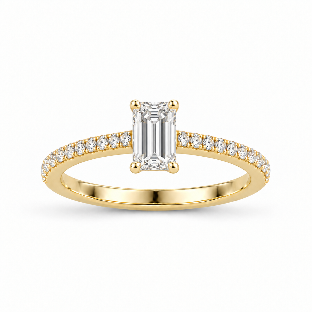 Anillo de oro amarillo 14k con diamante corte esmeralda y pavé en la banda